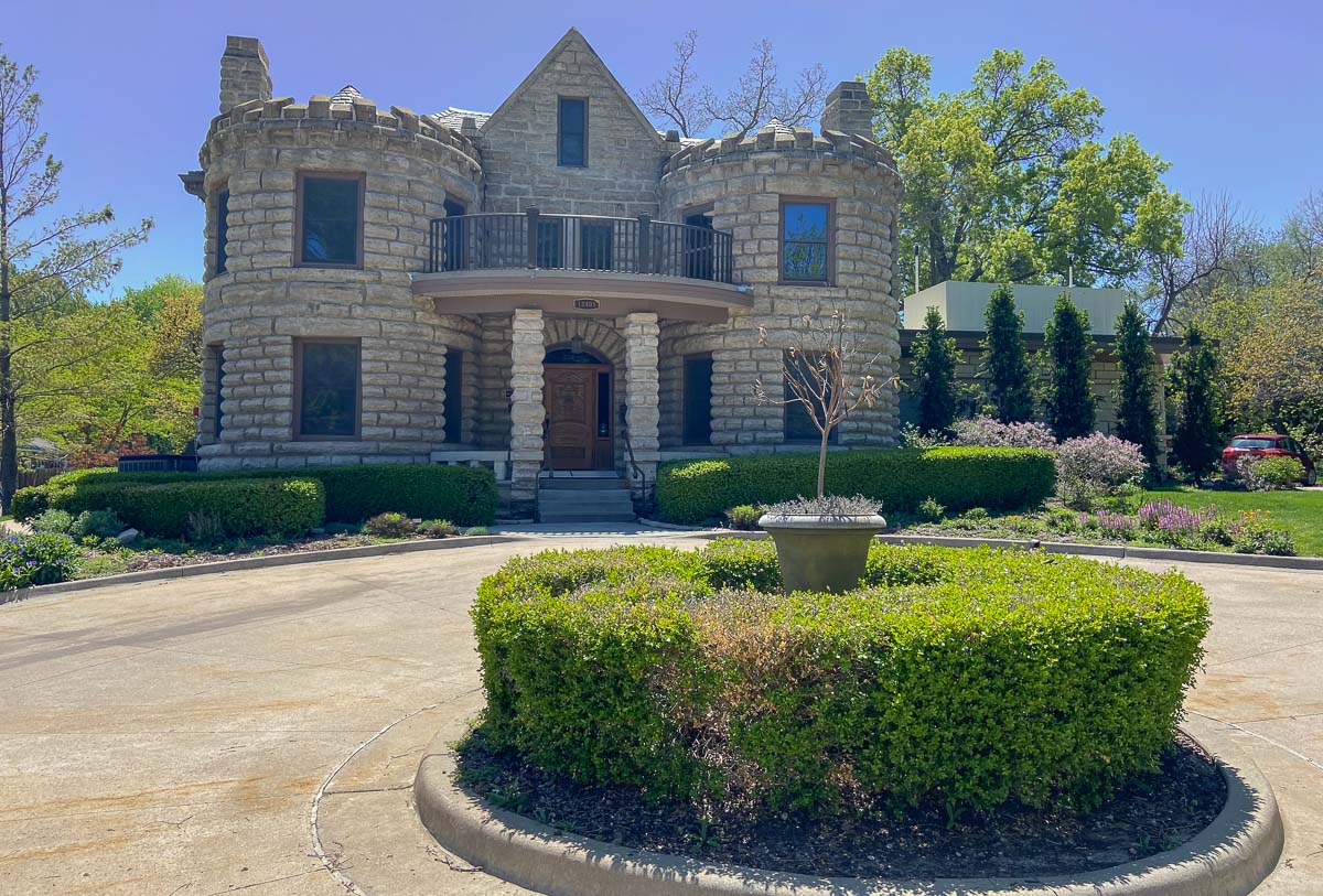 A beautiful castle located in Shawnee, Kansas on a sunny day. It's now the location of a restaurant called Wandering Vine at the Castle.