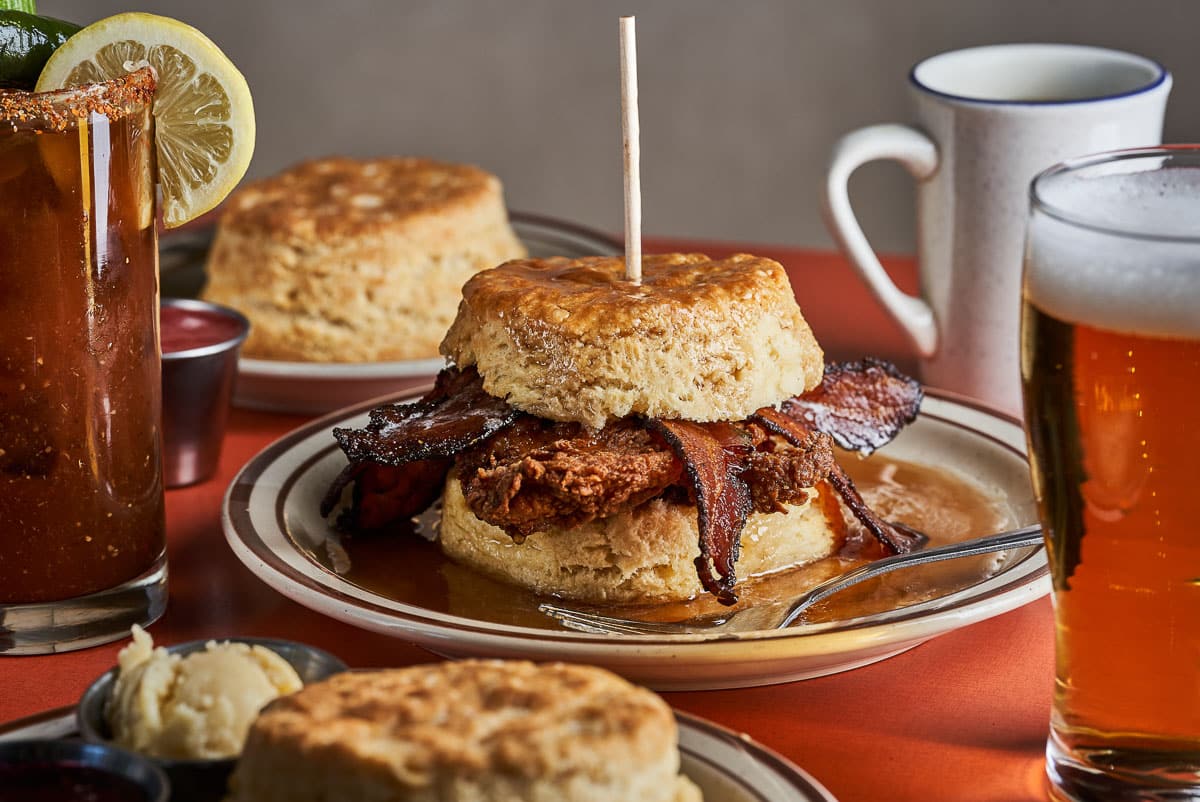 Huge, mouth watering breakfast sandwiches with chicken and bacon inside, topped with a homemade biscuit.