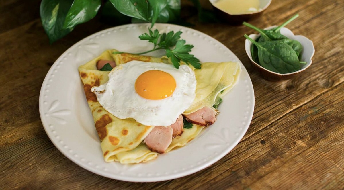 Savory crepes with an over easy egg on top offered at Seven Swans Creperie.